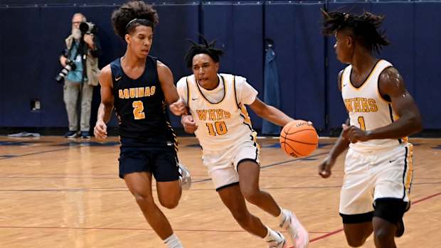 Winter Haven guard Eric Dailey drives the ball up floor against St. Thomas Aquinas on Saturday at the Kingdom in the Sun Tournament at Vanguard High School in Ocala. 